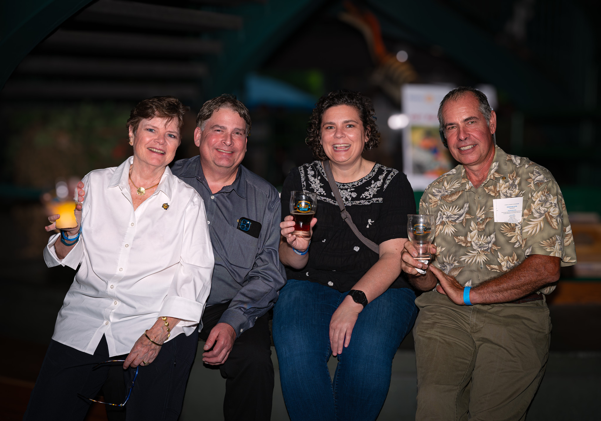 Friends gathering and smiling at the event